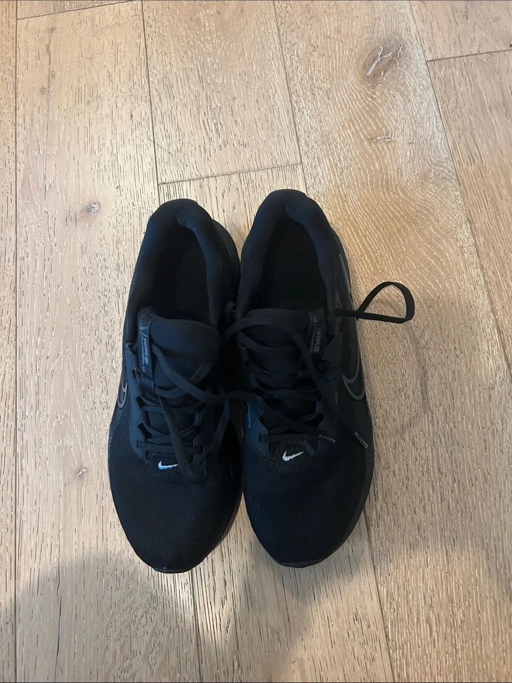 Nike Black Low-Top Sneakers with White Swoosh Accent